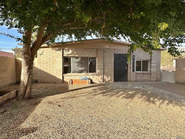 2176 E 14th Pl, Yuma, AZ 85365 - back of house featuring fence and brick siding