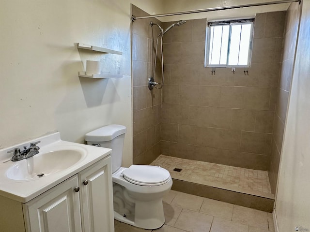 2176 E 14th Pl, Yuma, AZ 85365 - bathroom with toilet, a shower stall, tile patterned flooring, and vanity