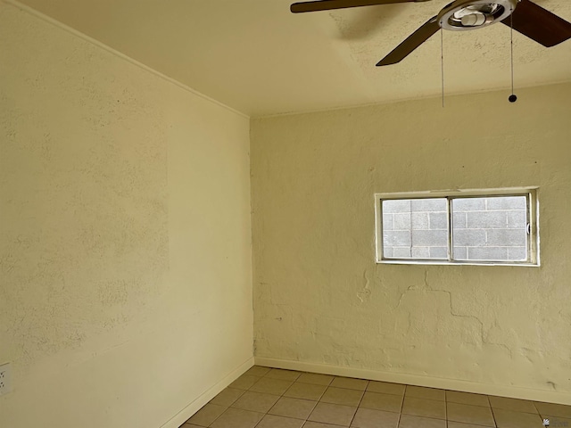2176 E 14th Pl, Yuma, AZ 85365 - tiled spare room featuring baseboards and a ceiling fan