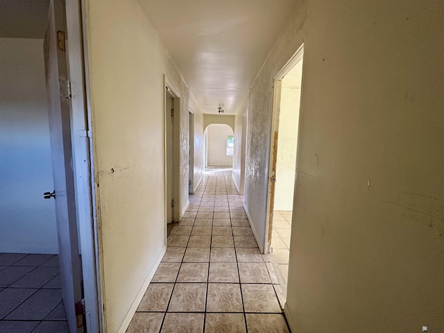2176 E 14th Pl, Yuma, AZ 85365 - hall featuring light tile patterned floors and arched walkways
