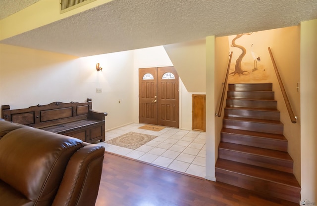 800 E Country Club Dr Unit 26, Yuma, AZ 85365 - living room featuring stairway, a textured ceiling, and light wood-style floors