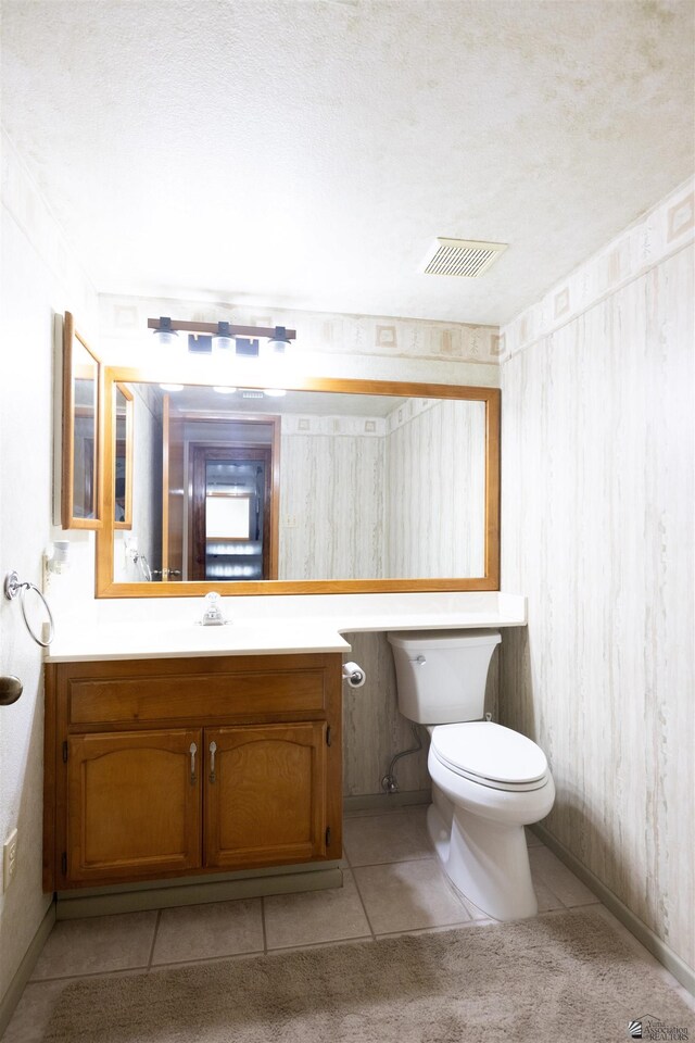 800 E Country Club Dr Unit 26, Yuma, AZ 85365 - half bath featuring vanity, toilet, tile patterned floors, and baseboards