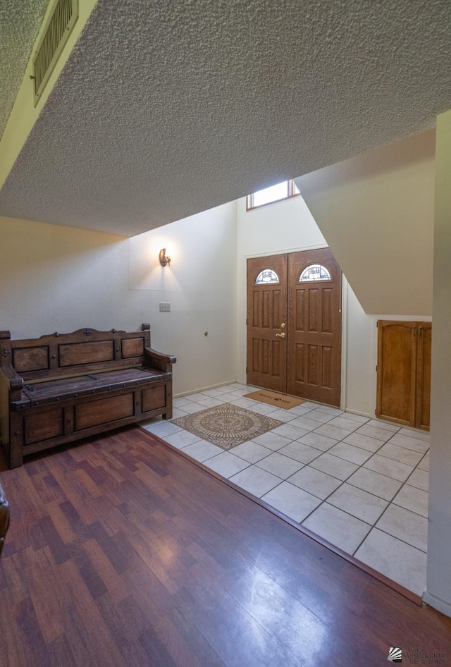 800 E Country Club Dr Unit 26, Yuma, AZ 85365 - entrance foyer with lofted ceiling, light wood-style flooring, and a textured ceiling
