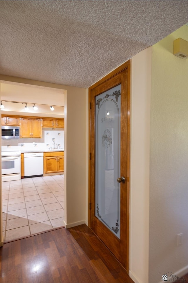 800 E Country Club Dr Unit 26, Yuma, AZ 85365 - corridor with light wood finished floors and baseboards