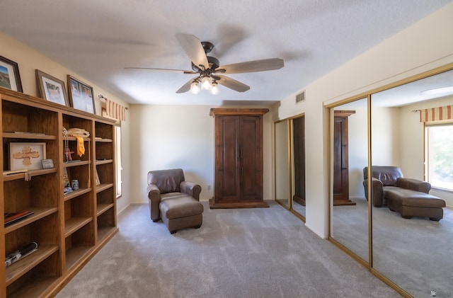 800 E Country Club Dr Unit 26, Yuma, AZ 85365 - sitting room featuring carpet and a ceiling fan