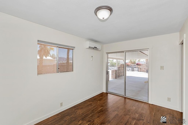 13466 E 47th St, Yuma, AZ 85367 - empty room with a wall unit AC and wood finished floors