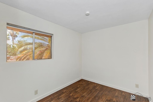 13466 E 47th St, Yuma, AZ 85367 - spare room with dark wood-style flooring and baseboards