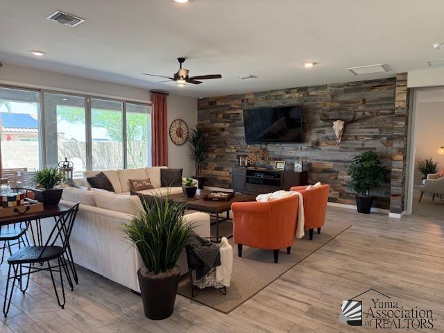 14700 E 42nd Pl, Yuma, AZ 85367 - living room featuring light wood-style flooring and ceiling fan