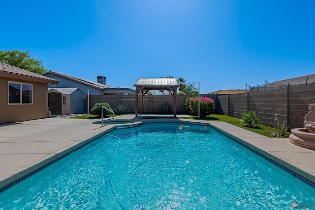 11594 E 27th Pl, Yuma, AZ 85367 - view of swimming pool with a gazebo, a storage shed, an outbuilding, a fenced backyard, and a patio