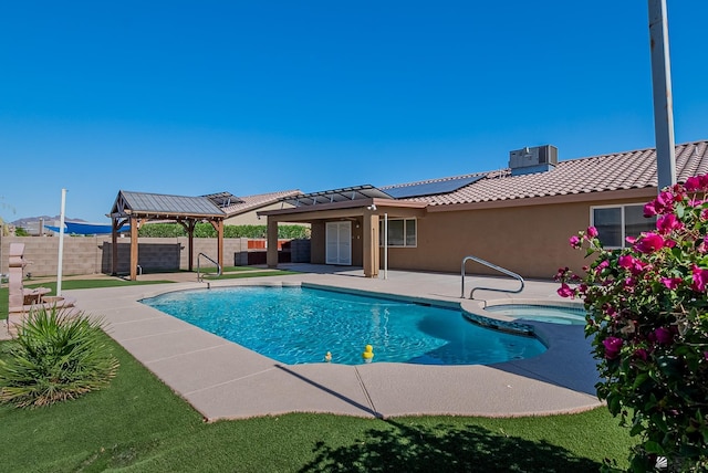 11594 E 27th Pl, Yuma, AZ 85367 - view of swimming pool with cooling unit, a gazebo, a fenced backyard, a patio area, and a pool with connected hot tub