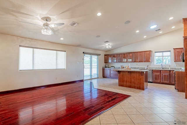 11594 E 27th Pl, Yuma, AZ 85367 - kitchen featuring a kitchen island, light countertops, a breakfast bar, lofted ceiling, and recessed lighting