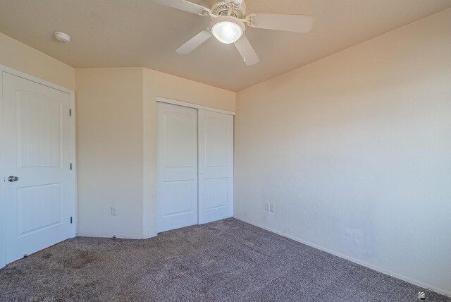 11594 E 27th Pl, Yuma, AZ 85367 - unfurnished bedroom with carpet, a closet, a ceiling fan, and baseboards