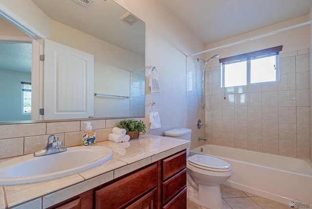 11594 E 27th Pl, Yuma, AZ 85367 - bathroom featuring tile patterned flooring, toilet, washtub / shower combination, and vanity