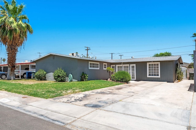 2621 S Walnut Ave, Yuma, AZ 85364 - ranch-style house featuring a front lawn and concrete driveway
