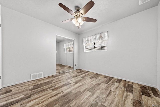 2621 S Walnut Ave, Yuma, AZ 85364 - empty room with wood finished floors and a ceiling fan