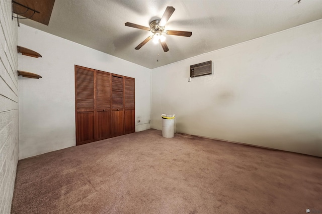 2621 S Walnut Ave, Yuma, AZ 85364 - unfurnished bedroom featuring carpet floors, an AC wall unit, a closet, and a ceiling fan