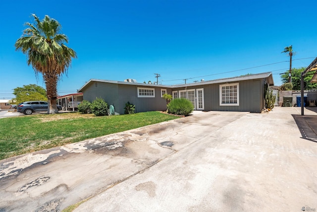 2621 S Walnut Ave, Yuma, AZ 85364 - ranch-style house with a front yard and driveway