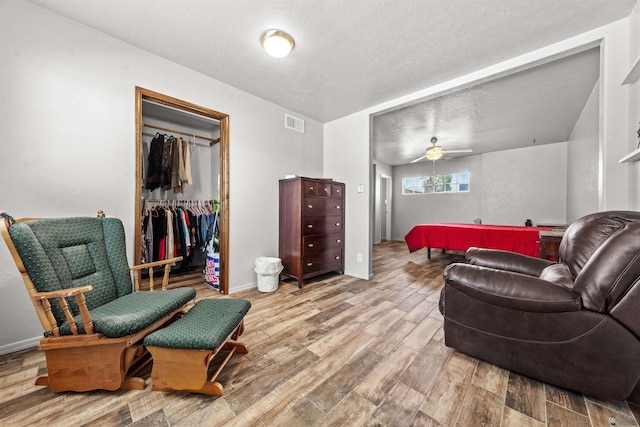 2621 S Walnut Ave, Yuma, AZ 85364 - living area featuring wood finished floors, ceiling fan, and a textured ceiling