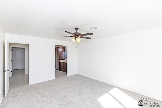 12683 E 51st Pl, Yuma, AZ 85367 - unfurnished bedroom featuring light colored carpet and ceiling fan