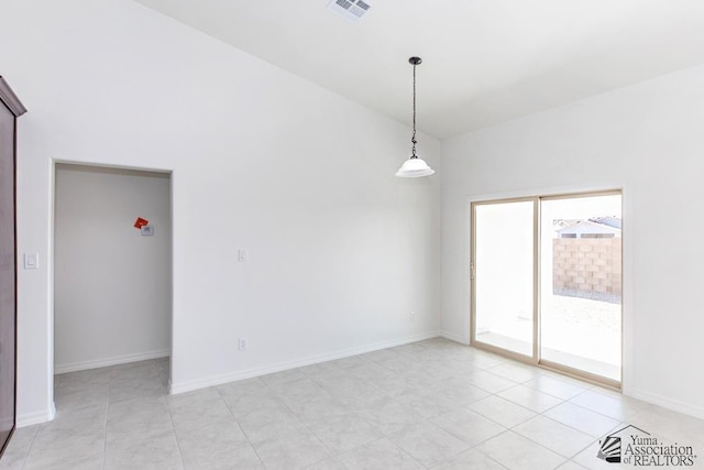 12683 E 51st Pl, Yuma, AZ 85367 - empty room with light tile patterned floors and vaulted ceiling