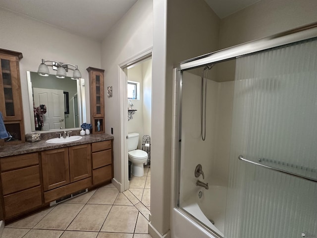14411 E 50th Dr, Yuma, AZ 85367 - bathroom featuring tile patterned flooring, vanity, and combined bath / shower with glass door