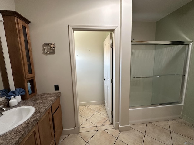 14411 E 50th Dr, Yuma, AZ 85367 - bathroom with vanity, tile patterned floors, and combined bath / shower with glass door