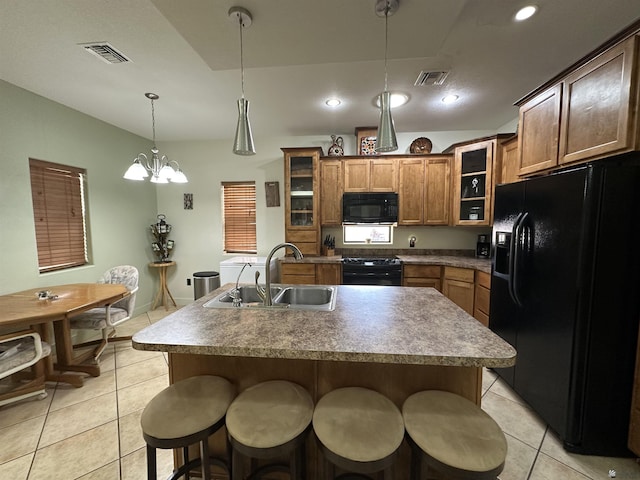 14411 E 50th Dr, Yuma, AZ 85367 - kitchen with black appliances, light tile patterned floors, a kitchen breakfast bar, glass insert cabinets, and recessed lighting