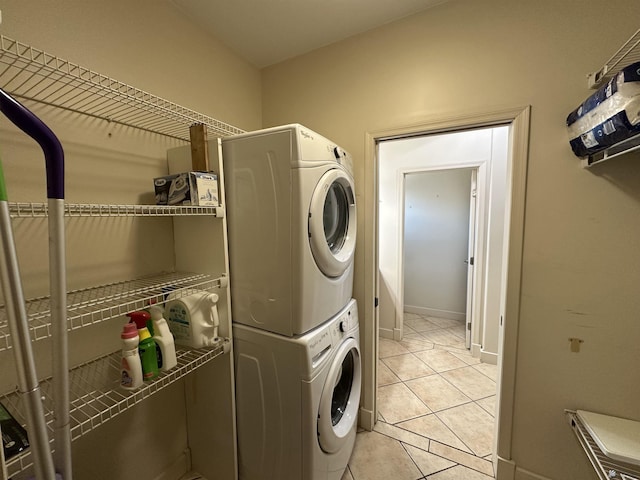 14411 E 50th Dr, Yuma, AZ 85367 - laundry room featuring stacked washing machine and dryer and light tile patterned flooring