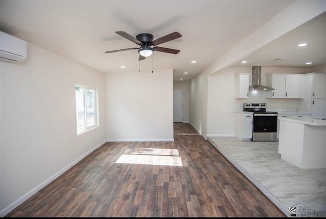 350 S Monte Vis, Yuma, AZ 85364 - unfurnished living room featuring ceiling fan, recessed lighting, baseboards, a wall unit AC, and wood finished floors