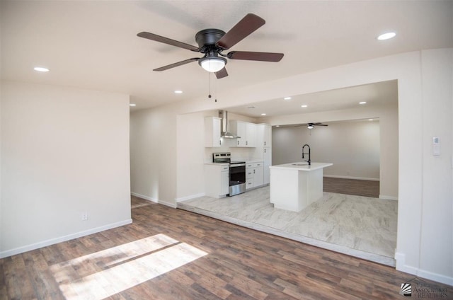 350 S Monte Vis, Yuma, AZ 85364 - unfurnished living room with baseboards, ceiling fan, recessed lighting, a sink, and light wood finished floors