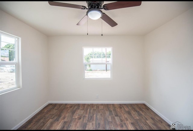 350 S Monte Vis, Yuma, AZ 85364 - empty room featuring a ceiling fan, baseboards, dark wood-style floors, and a healthy amount of sunlight