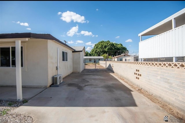 350 S Monte Vis, Yuma, AZ 85364 - view of home's exterior featuring fence, stucco siding, and ac unit