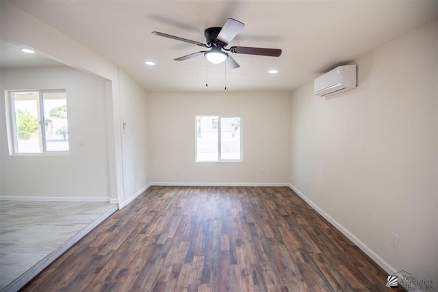 350 S Monte Vis, Yuma, AZ 85364 - empty room with plenty of natural light, a wall mounted AC, a ceiling fan, and dark wood-style flooring