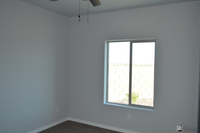 13113 E 54th St Lot 37, Yuma, AZ 85367 - empty room with ceiling fan and dark colored carpet