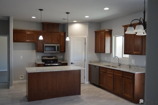 13113 E 54th St Lot 37, Yuma, AZ 85367 - kitchen with stainless steel microwave, dishwashing machine, electric range, a kitchen island, and hanging light fixtures
