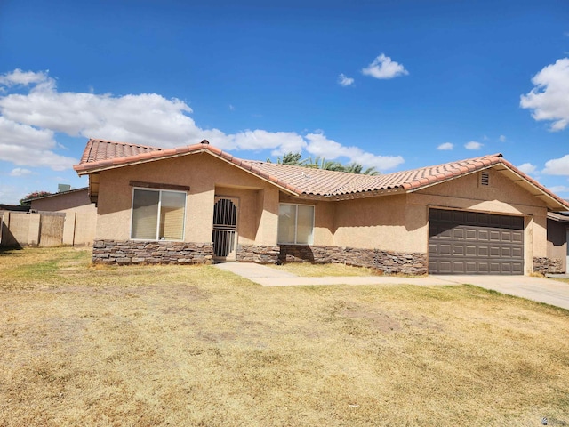 view of front of home with a garage, stucco siding, a tiled roof, and fence