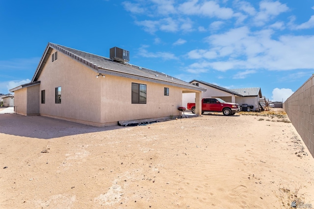 3830 E Jett St, San Luis, AZ 85336 - back of house featuring central air condition unit