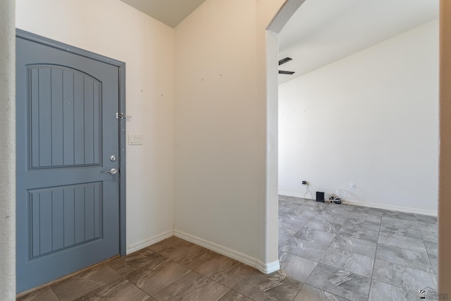 3830 E Jett St, San Luis, AZ 85336 - foyer entrance featuring arched walkways, marble finish flooring, and baseboards