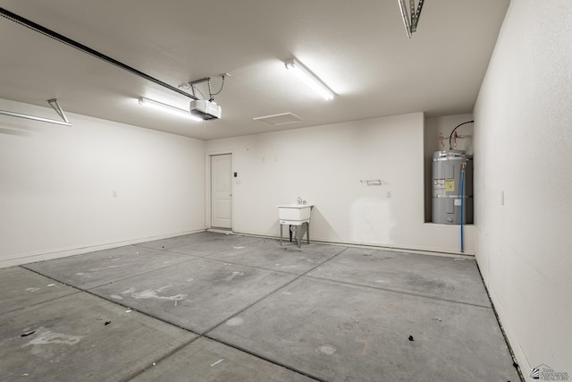 3830 E Jett St, San Luis, AZ 85336 - garage featuring water heater and a garage door opener