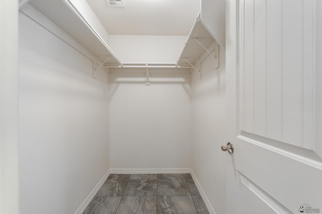 3830 E Jett St, San Luis, AZ 85336 - spacious closet featuring marble look tile flooring