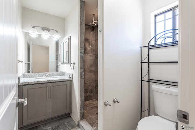 3830 E Jett St, San Luis, AZ 85336 - full bath with marble finish floors, vanity, a tile shower, and toilet
