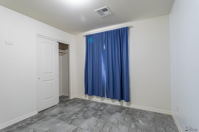 3830 E Jett St, San Luis, AZ 85336 - unfurnished bedroom featuring a closet and baseboards