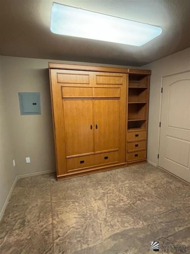 unfurnished bedroom featuring electric panel