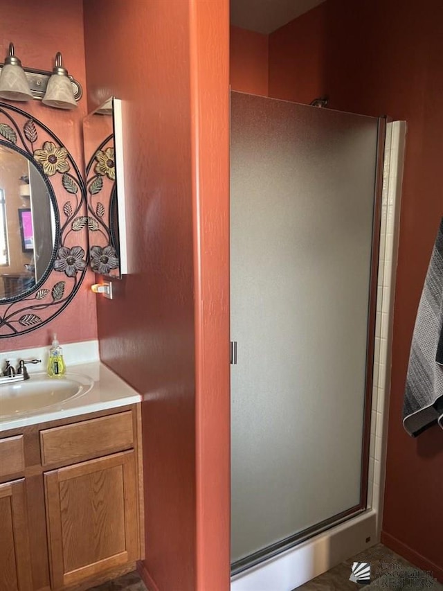 bathroom with vanity and an enclosed shower