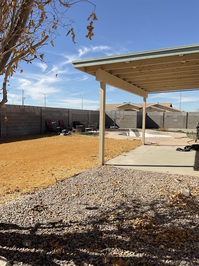 view of yard featuring a patio and a fenced backyard