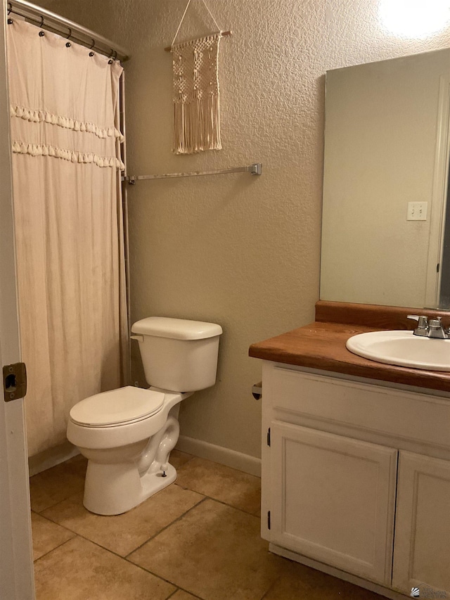 full bath featuring toilet, tile patterned floors, a shower with curtain, and vanity