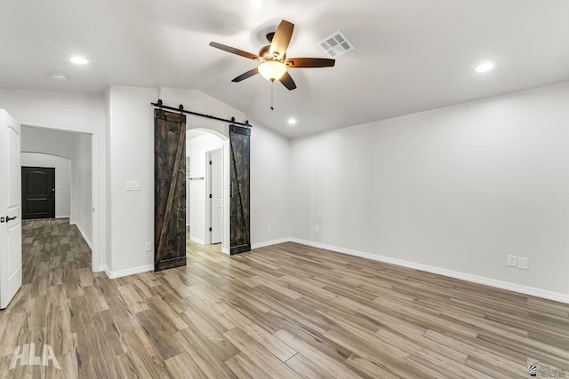 12616 E 49th Dr, Yuma, AZ 85367 - empty room featuring ceiling fan, light wood-style flooring, a barn door, and visible vents