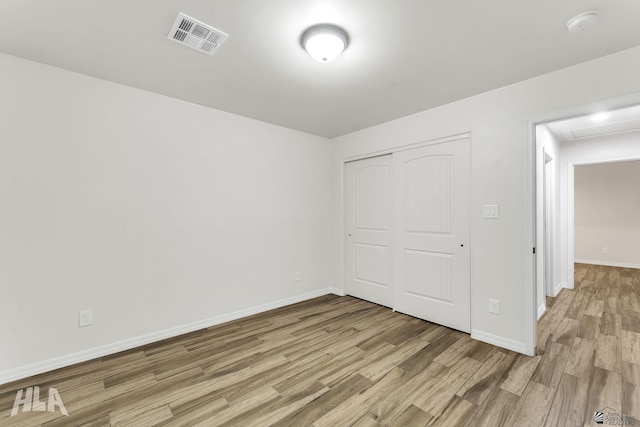 12616 E 49th Dr, Yuma, AZ 85367 - unfurnished bedroom featuring visible vents, baseboards, a closet, and light wood-type flooring