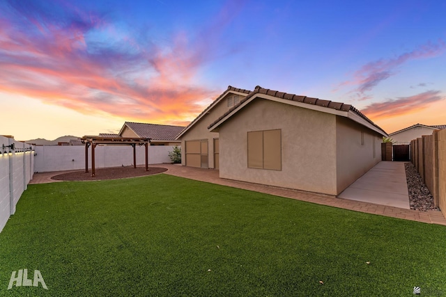 12616 E 49th Dr, Yuma, AZ 85367 - back of property with a pergola, stucco siding, a fenced backyard, a patio, and a yard
