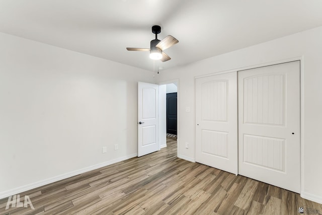12616 E 49th Dr, Yuma, AZ 85367 - unfurnished bedroom with light wood-style floors, baseboards, a ceiling fan, and a closet